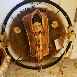 2 porcelain native American baby dolls with certificate of authenticity
